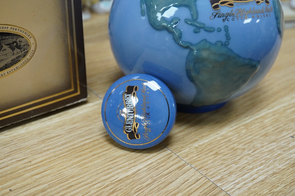 A boxed bottle of Glenturret single highland malt whisky, housed in a globe decanter